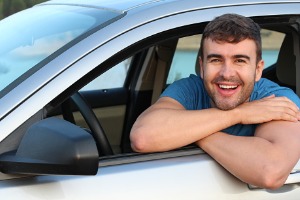 Young Man Smiling In Car